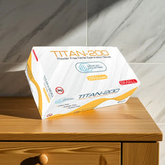 Box of Titan-200 gloves on a wooden surface with a marble wall background