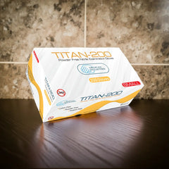 Box of Titan-200 gloves on a wooden surface with a marble background