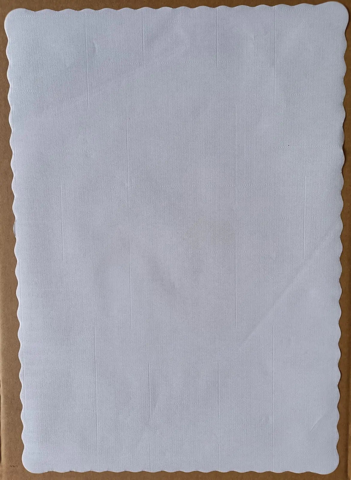 White fabric tork traymat on a brown background