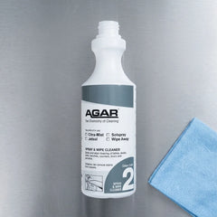 Antibacterial spray and wipe cleaner being applied to a commercial kitchen benchtop for a streak free finish.