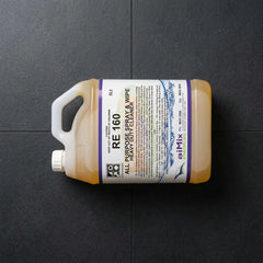 A commercial cleaner using a microfibre cloth and Eve Zone hard surface cleaner to wipe down an office desk.