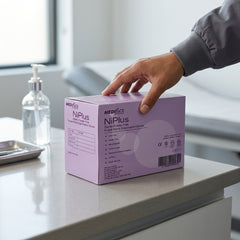 Close-up of Ni Plus purple nitrile sterile gloves showing micro-textured fingertips for precision grip.