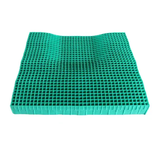 Isolated view of an ergonomically contoured teal gel grid seat cushion insert.