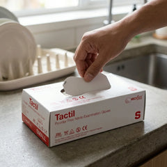Close-up of Tactil blue nitrile gloves demonstrating a snug fit and high tactile sensitivity for precision tasks.